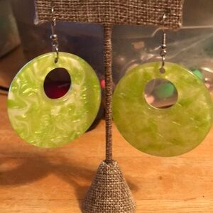 Light green dangle circle earrings on shepherds hook